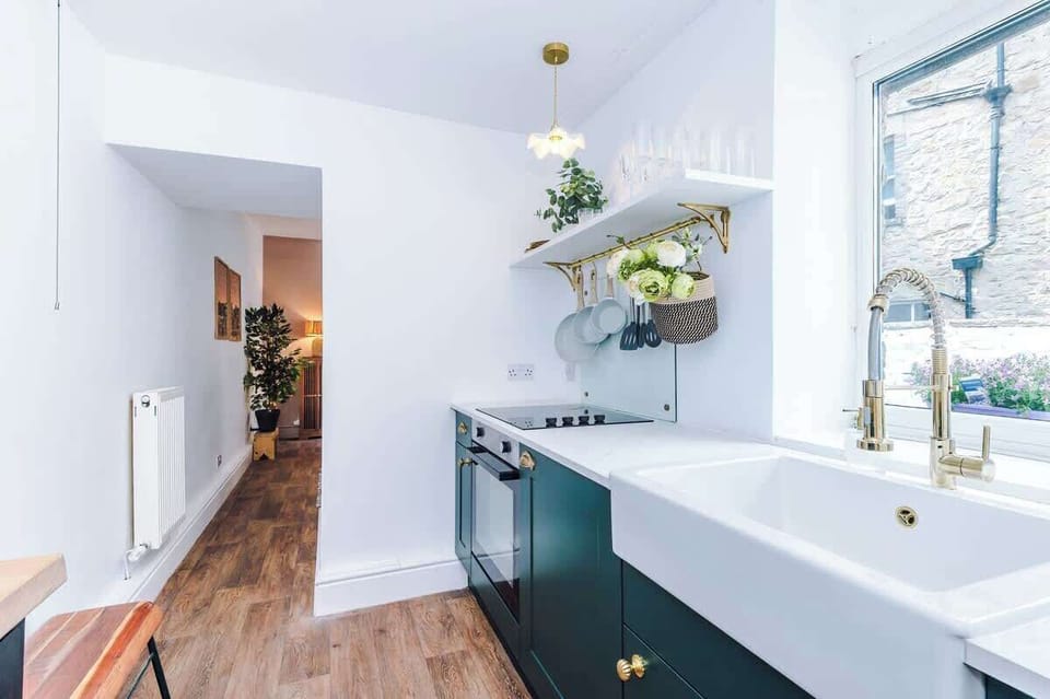 Fully equipped kitchen. Stylish, modern space featuring a farmhouse sink, wooden countertops, and all the essentials for your stay.