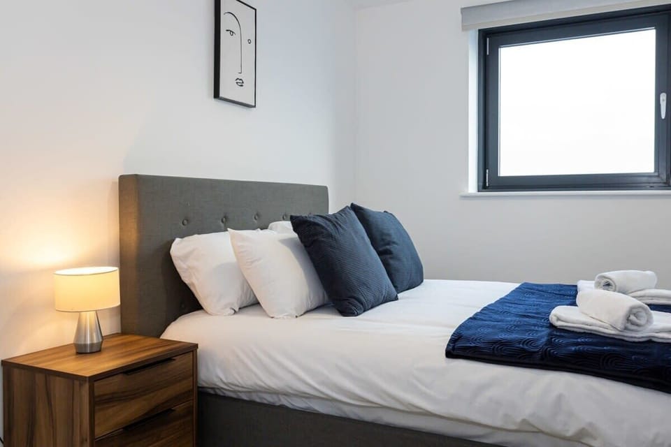 Wake up refreshed in the second bedroom, dressed in quality navy bedding for a restful night