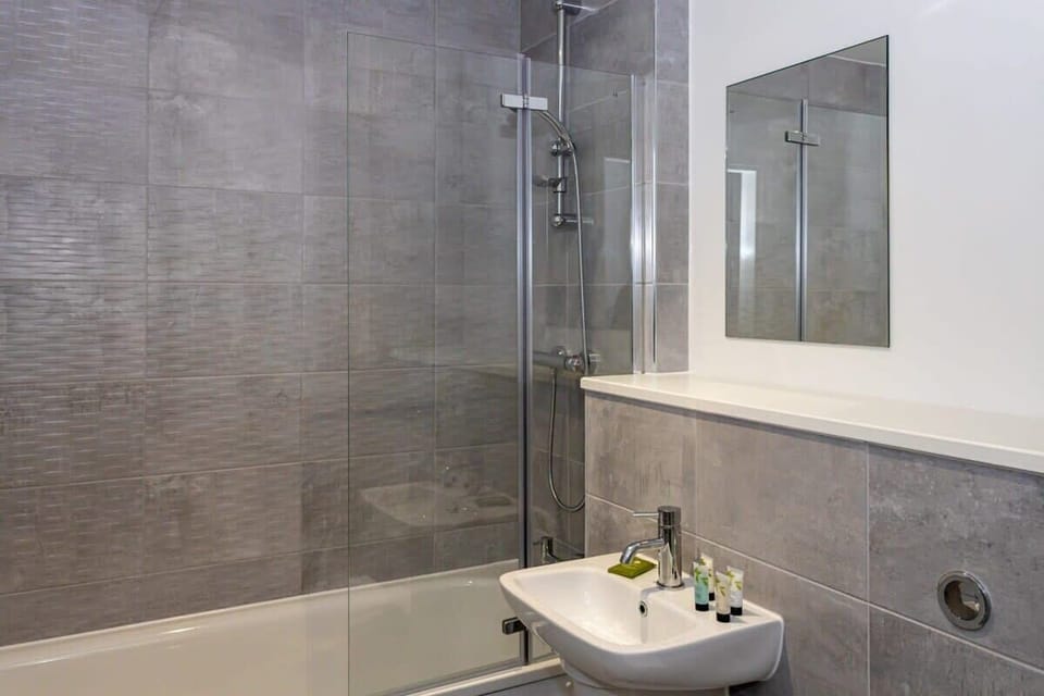 The second bedroom offers the same quality bedding and thoughtful touches for a comfortable stay