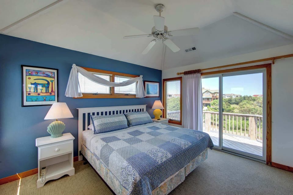 Top Level Master King w/ Ensuite Full Bath, a flat-screen TV, plenty of storage and deck access