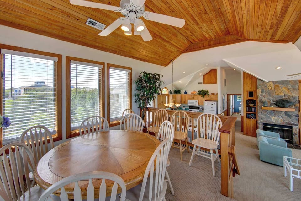 Elevated dining space with an oval dining table seating for 8