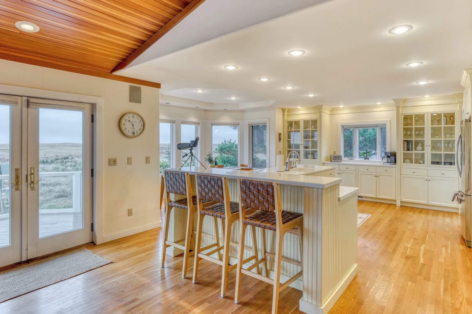 Step out onto the deck or enjoy bird watching right from the kitchen island with scenic views and peaceful surroundings all around.