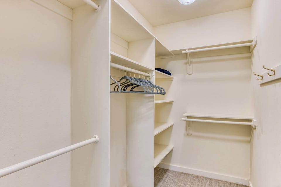 The primary bedroom's walk-in closet provides ample space for your wardrobe, making it easy to stay awhile and feel at home.