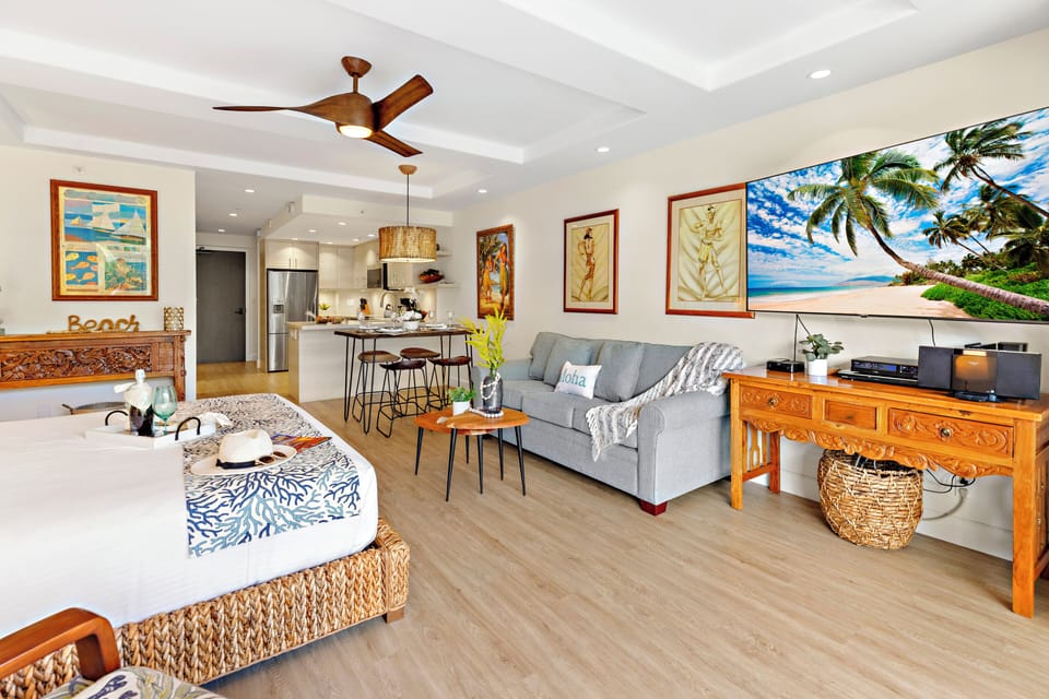 Unwind in a bright and welcoming living area, complete with a flat-screen TV and comfortable furnishings. Perfect for peaceful lounging.