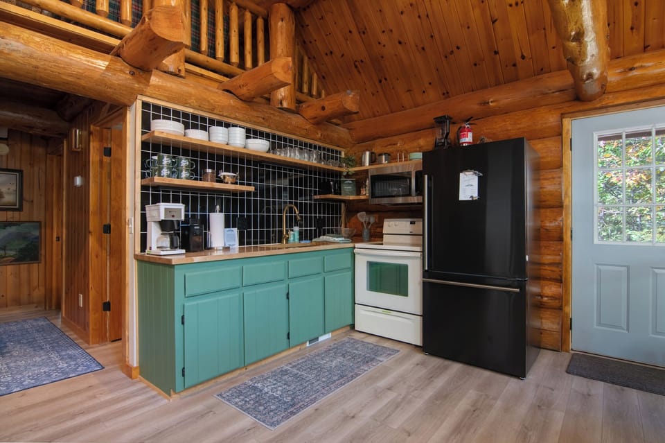 Enjoy prepping meals in the open, fully-stocked kitchen with open shelving.