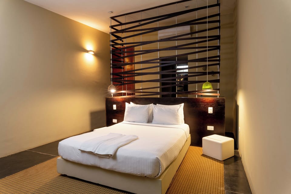 Deluxe Suite | 12 bedrooms, individually furnished, blackout drapes, iron/ironing board