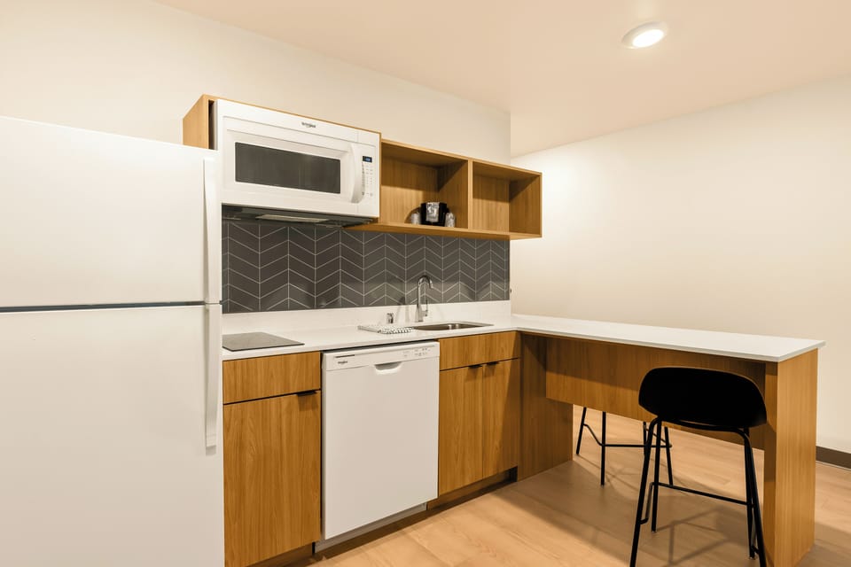 Studio Suite, 2 Queen Beds | Private kitchen | Full-size fridge, microwave, stovetop, dishwasher