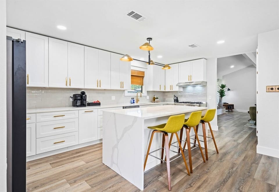 Another angle of the kitchen reveals even more prep space and storage. You'll find everything you need right at your fingertips.