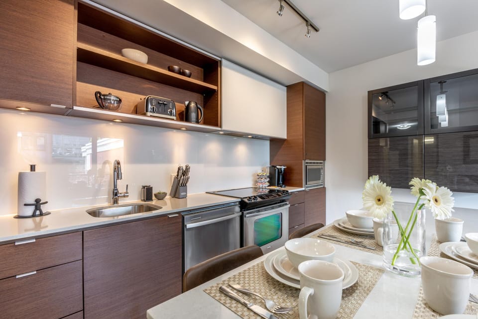 Detailed view of the multi-functional kitchen island breakfast bar set for dining.