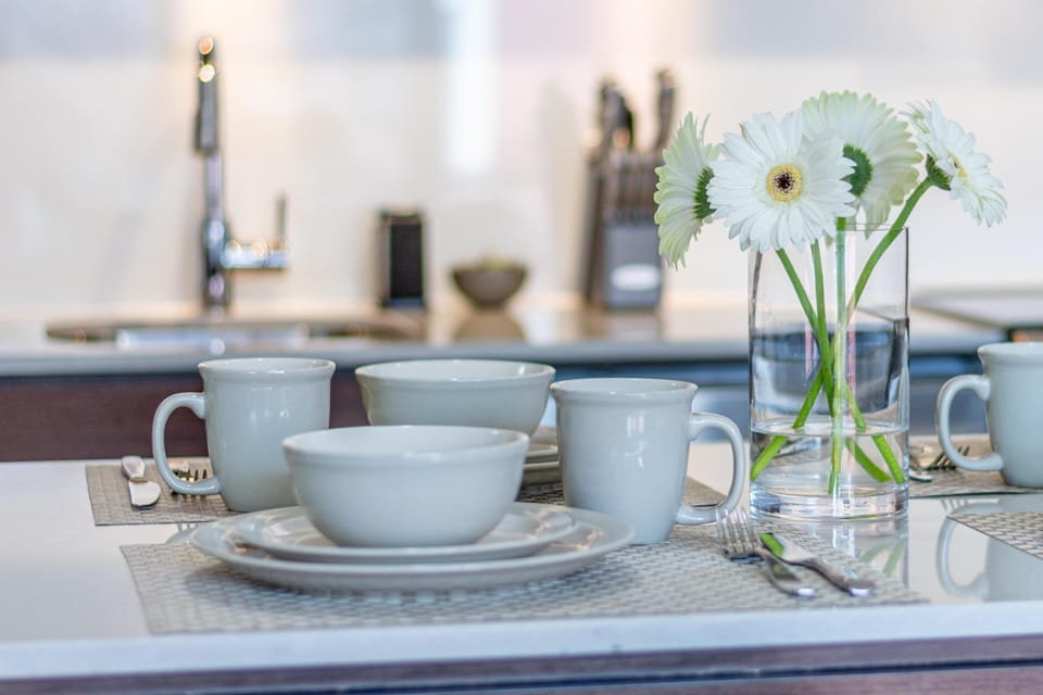 Alternate close-up angle of the kitchen island prep counter and dining space.