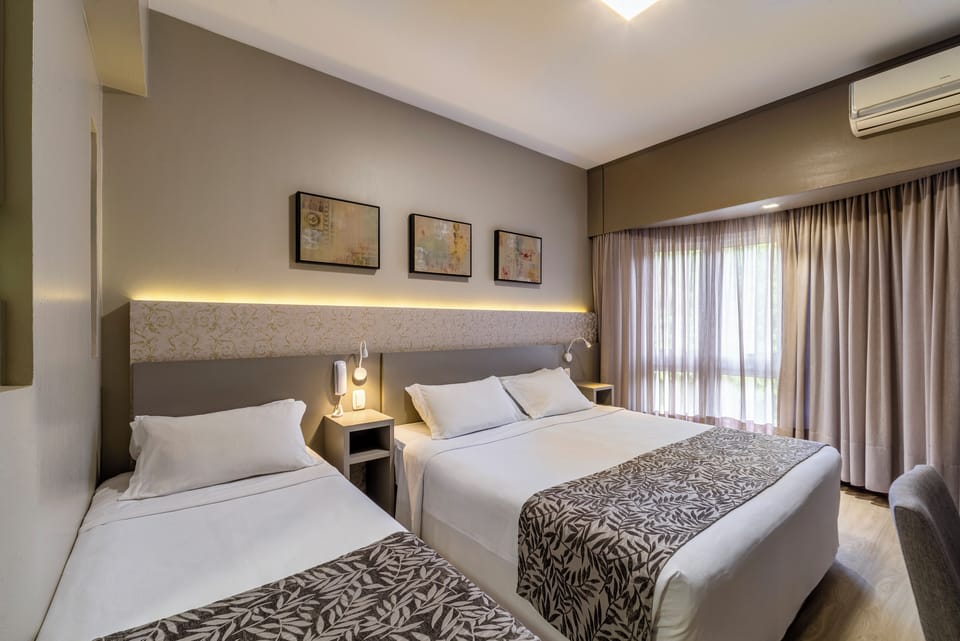 Deluxe Room | Minibar, desk, blackout drapes, soundproofing