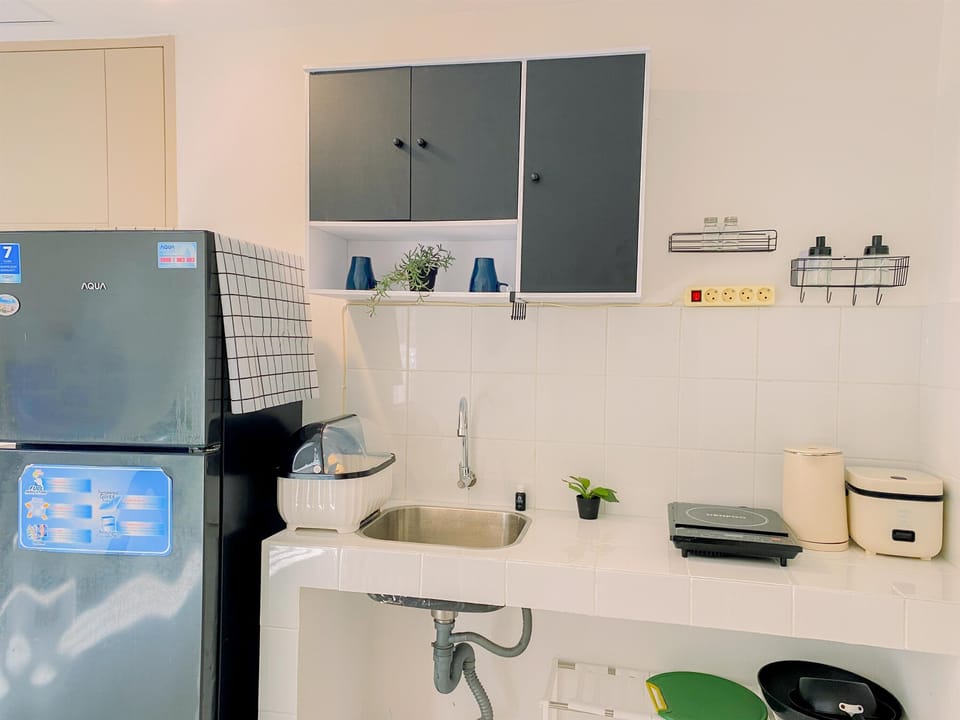 Apartment | Private kitchen | Fridge, stovetop, rice cooker, dining tables