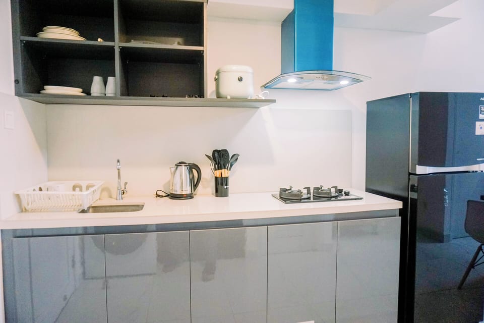 Apartment | Private kitchen | Fridge, stovetop, rice cooker, dining tables