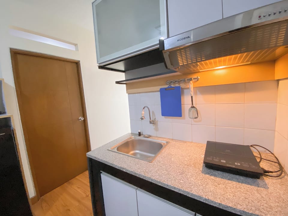 Apartment | Private kitchen | Fridge, stovetop, rice cooker, dining tables
