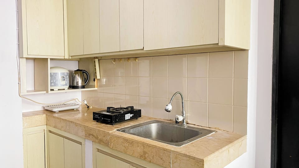 Apartment | Private kitchen | Fridge, stovetop, rice cooker, dining tables