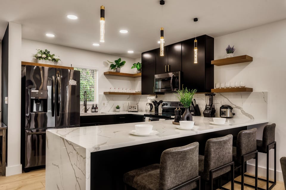Custom cabinets and open shelving ensure plenty of space for organization.