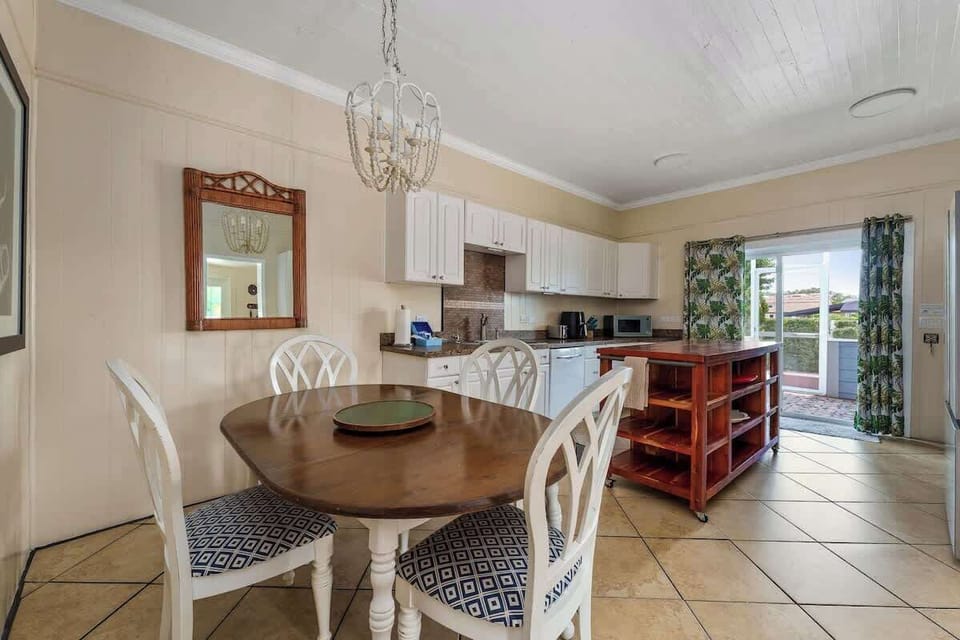Fun eclectic dining area offers spillover seating from the breakfast area of the kitchen. 