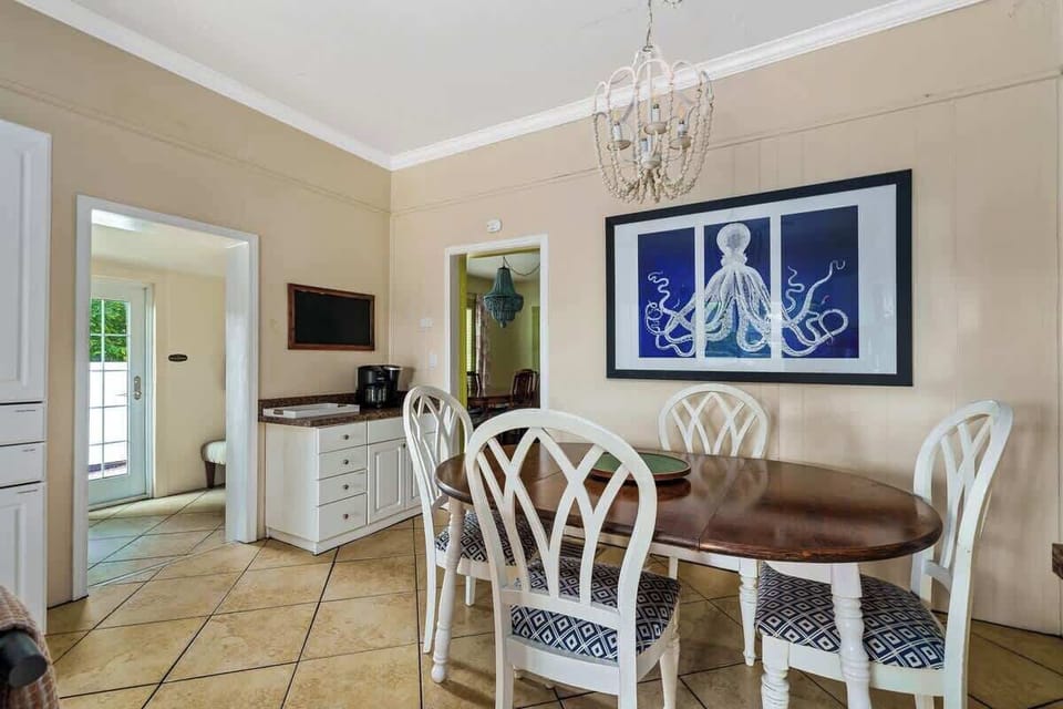 Fun eclectic dining area offers spillover seating from the breakfast area of the kitchen. 