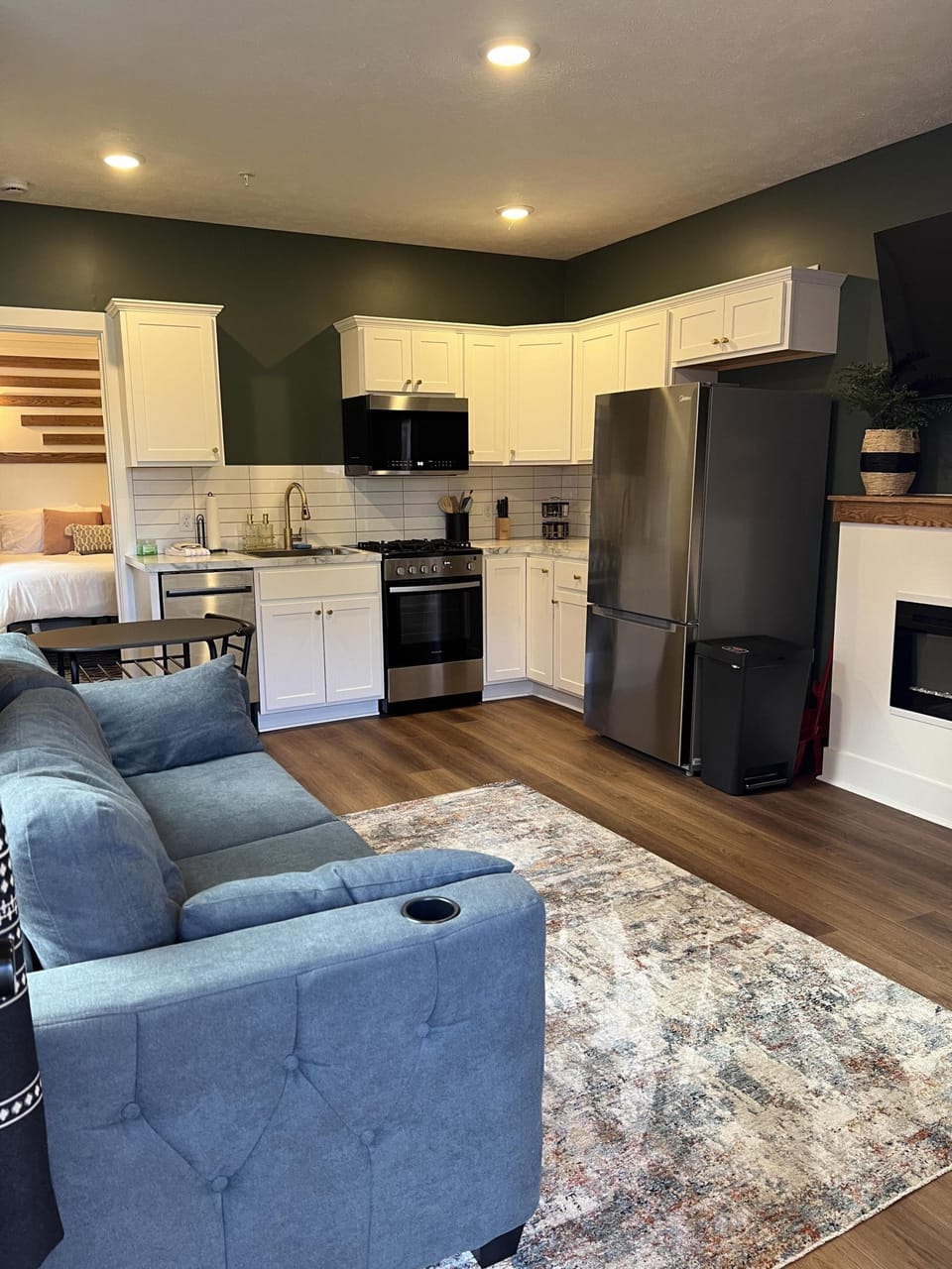 Urban Queen at the Victorian Unit D living area, kitchen, sofa bed, 300 sq. ft.