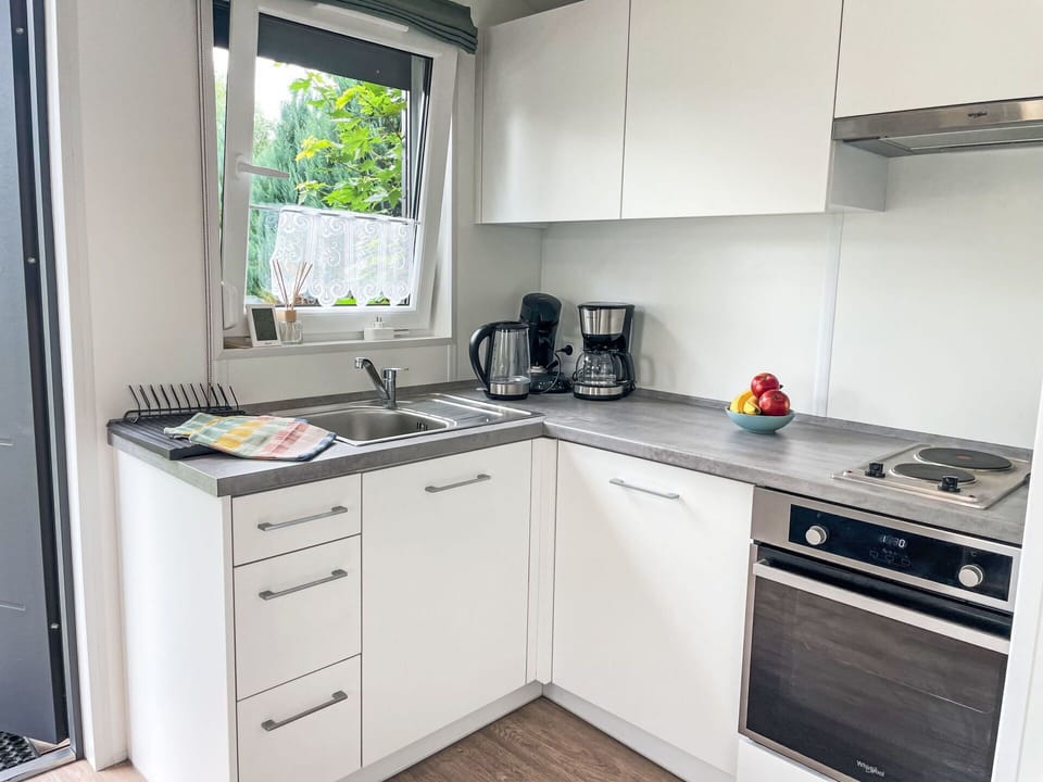 Cabinetry, Kitchen Sink, Sink, Building, Countertop, Tap, Window, Kitchen Stove, Kitchen, Kitchen Appliance