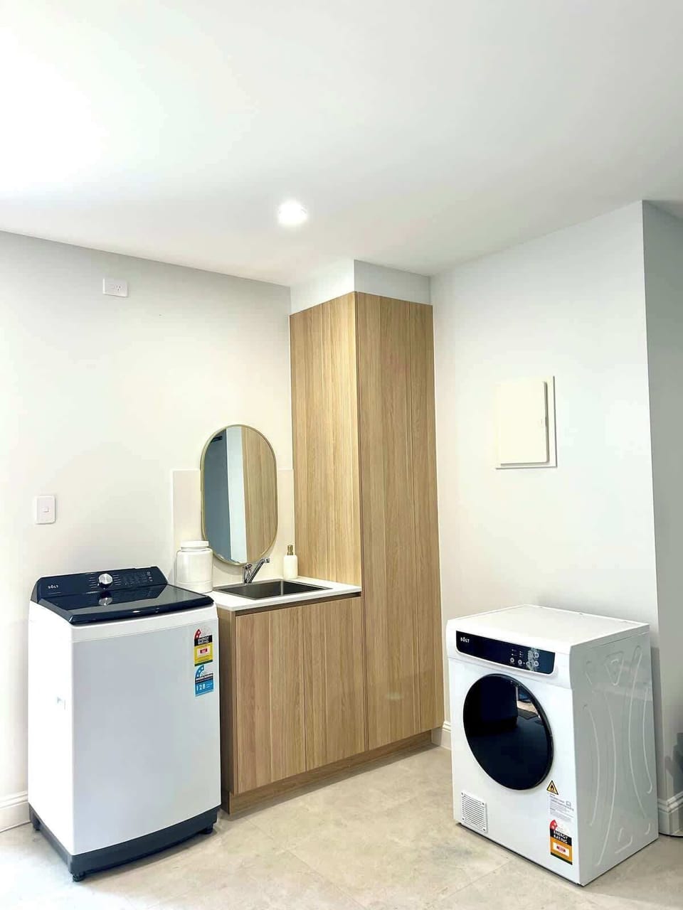 Laundry with washing machine, dryer and sink