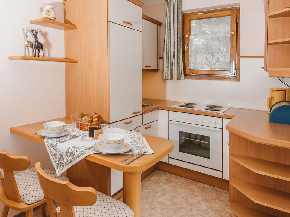 Furniture, Table, Property, Cabinetry, Building, Countertop, Wood, Kitchen, Chair, Window