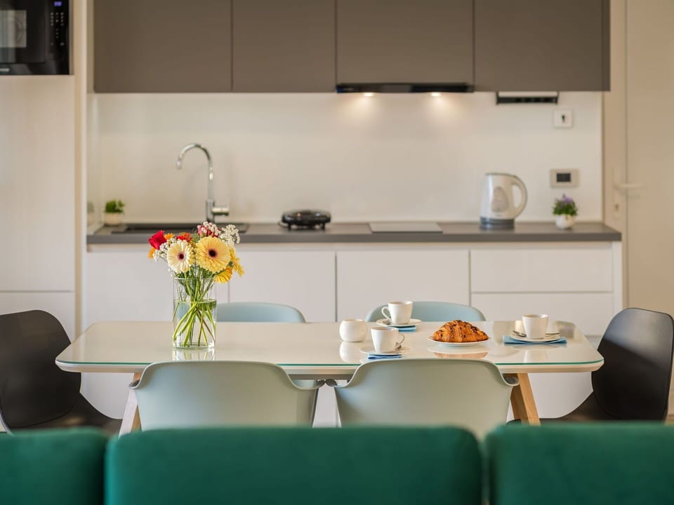 Furniture, Property, Table, Cabinetry, Flower, White, Countertop, Chair, Kitchen, Tableware