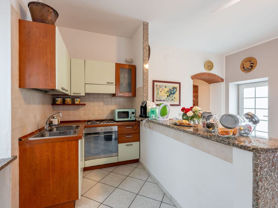 Countertop, Cabinetry, Property, Sink, Kitchen Sink, Kitchen Stove, Kitchen, Interior Design, Wood, Lighting