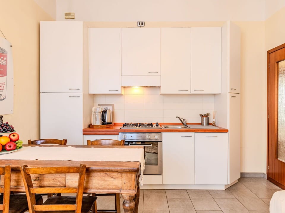 Cabinetry, Furniture, Countertop, Kitchen Stove, Wood, Kitchen, Kitchen Appliance, Orange, Floor, Flooring