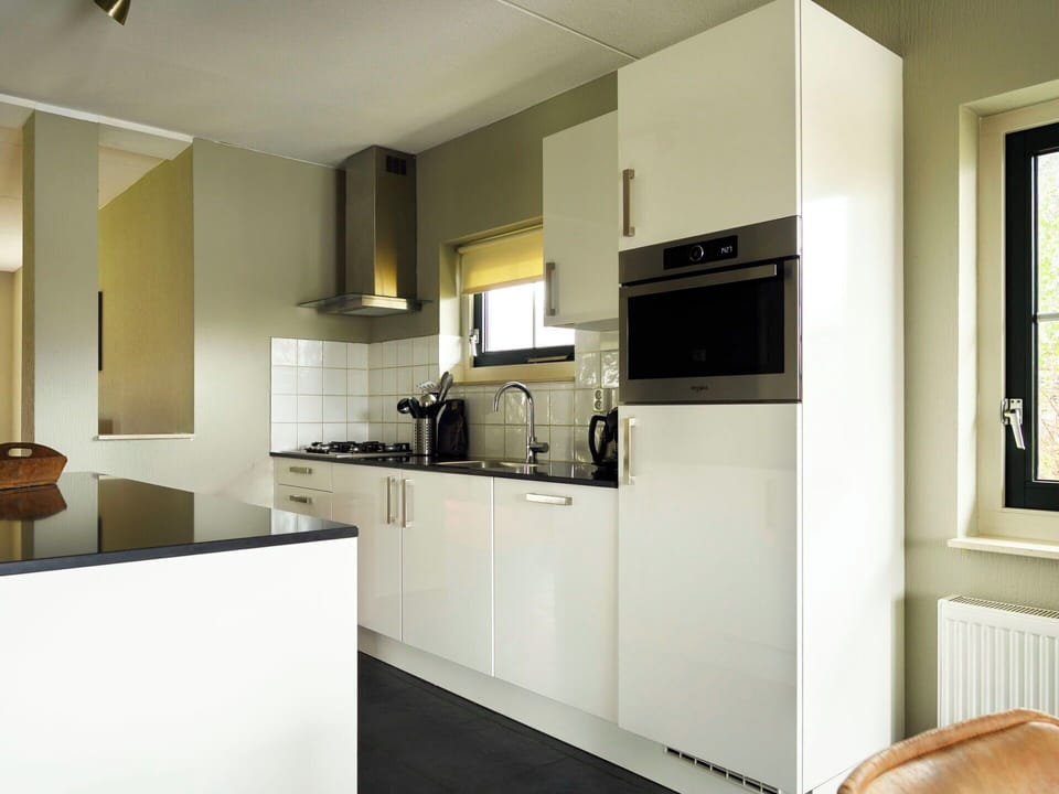 Kitchen, Countertop, Interior Design, Flooring, Kitchen Appliance, Cabinetry, Ceiling, Light Fixture, Major Appliance, Floor