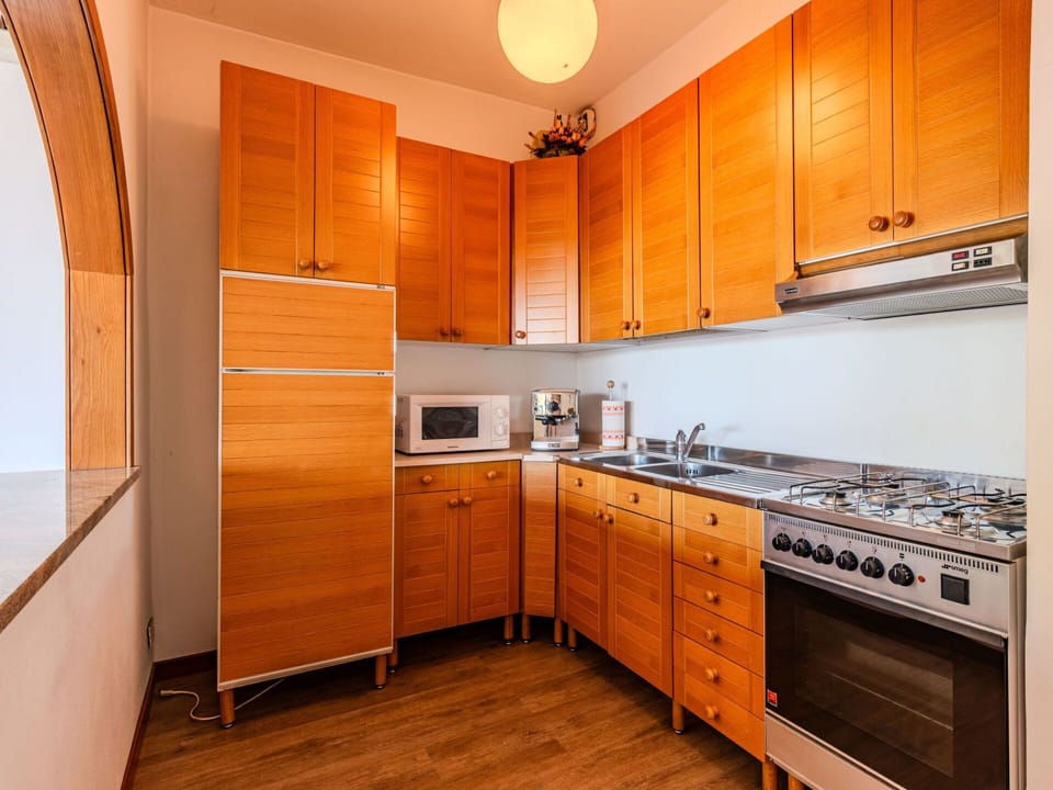 Cabinetry, Countertop, Kitchen Appliance, Kitchen Stove, Home Appliance, Wood, Interior Design, Kitchen, Orange, Building