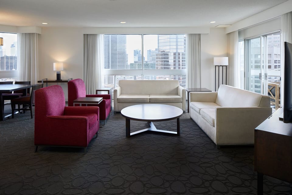 Club Suite, 1 Bedroom, Non Smoking | Living room | 42-inch LCD TV with digital channels, TV, iPod dock