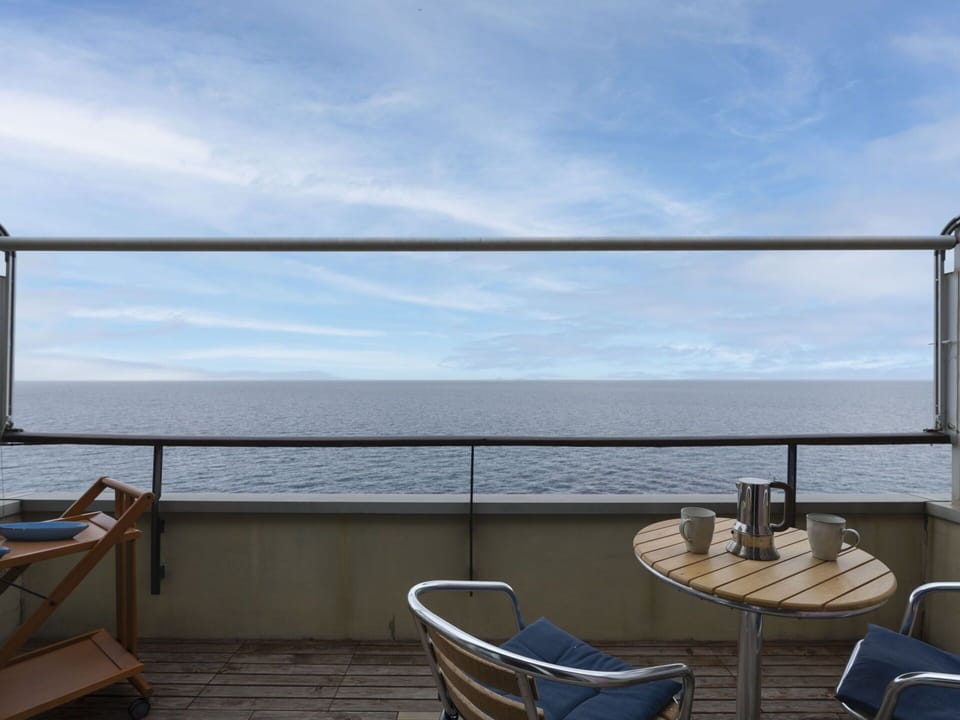 Sky, Cloud, Water, Property, Furniture, Azure, Chair, Outdoor Furniture, Shade, Wood