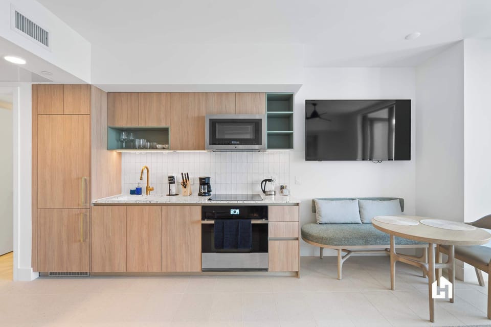 Whip up meals in this chic, fully-equipped kitchen & enjoy cozy dining.