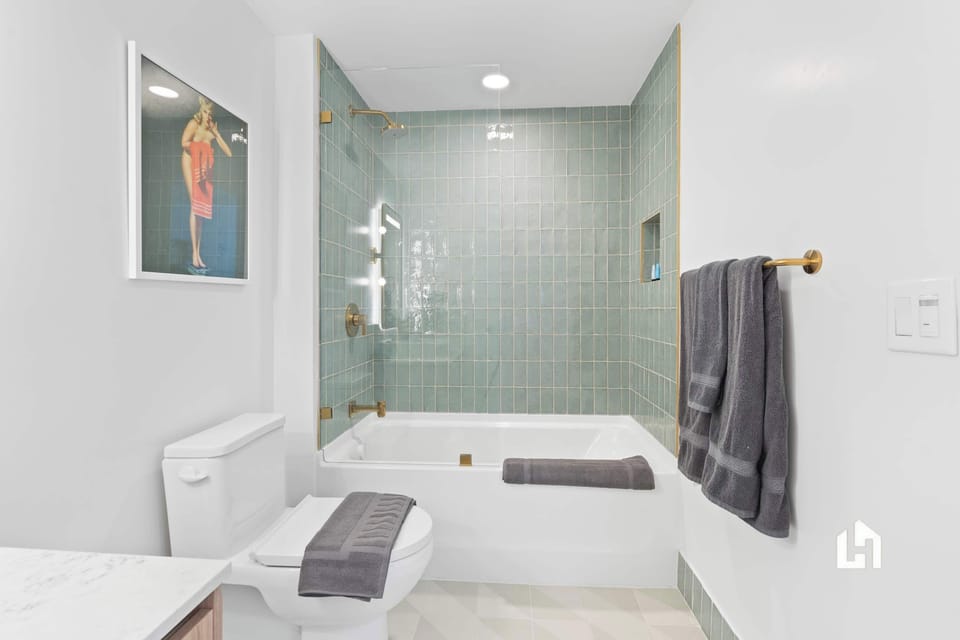 The ensuite full bath has a shower/tub combo