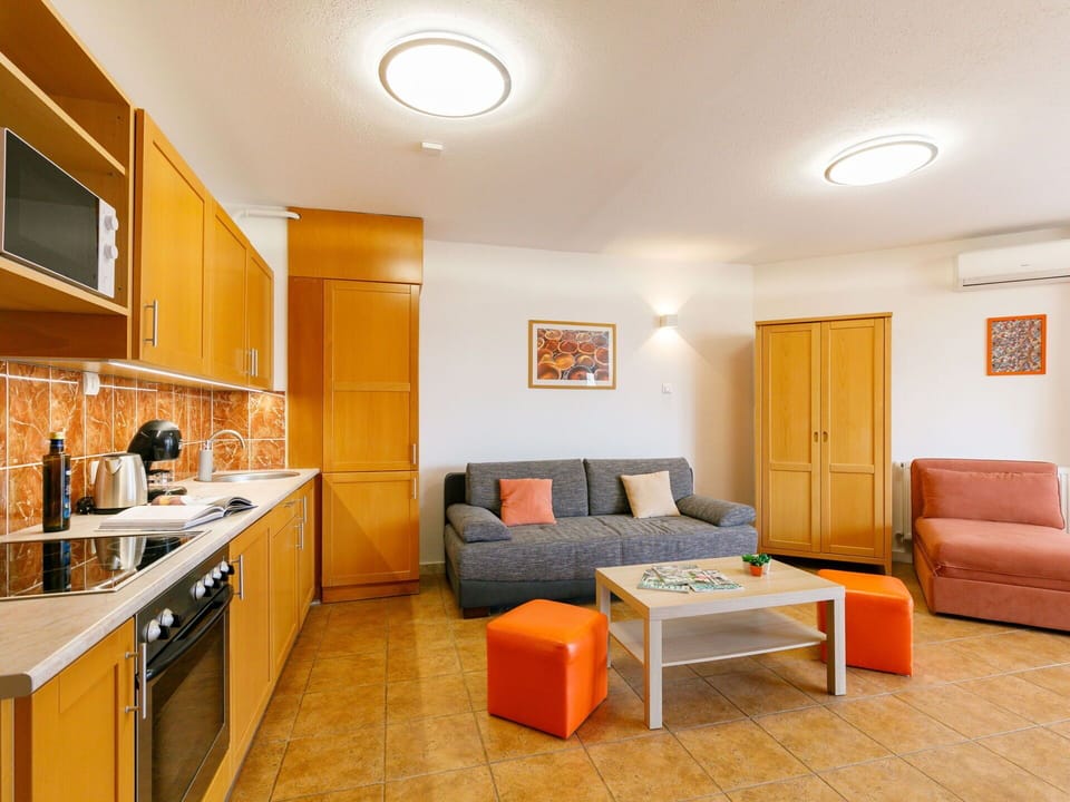 Furniture, Property, Cabinetry, Countertop, Sink, Couch, Building, Comfort, Orange, Table
