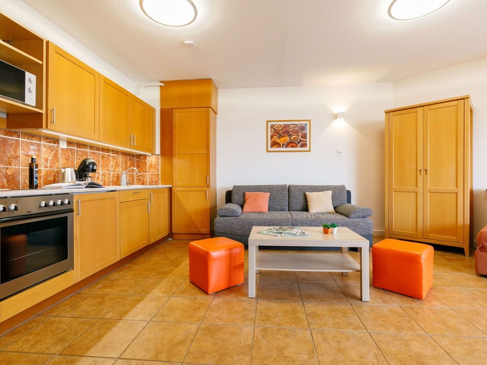 Furniture, Property, Cabinetry, Table, Couch, Countertop, Comfort, Building, Orange, Wood