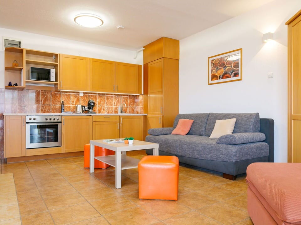 Furniture, Couch, Orange, Table, Wood, Lighting, Comfort, Living Room, Cabinetry, Studio Couch