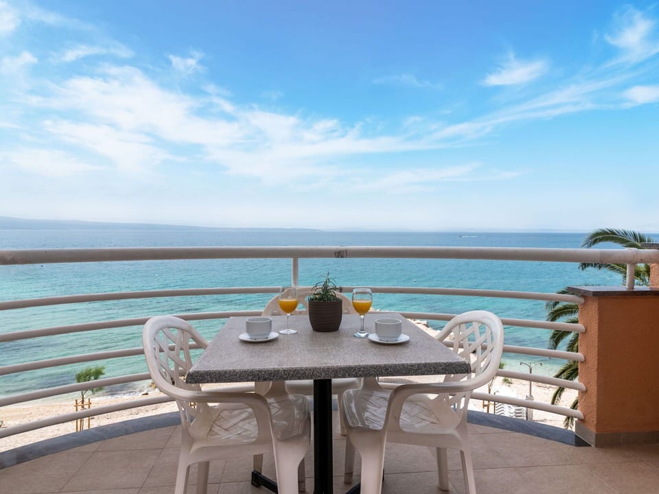 Sky, Water, Cloud, Table, Furniture, Azure, Chair, Seaside Resort, Outdoor Furniture, Coastal And Oceanic Landforms