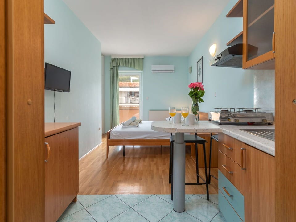 Cabinetry, Countertop, Furniture, Wood, Orange, Interior Design, Table, Architecture, Floor, Flooring