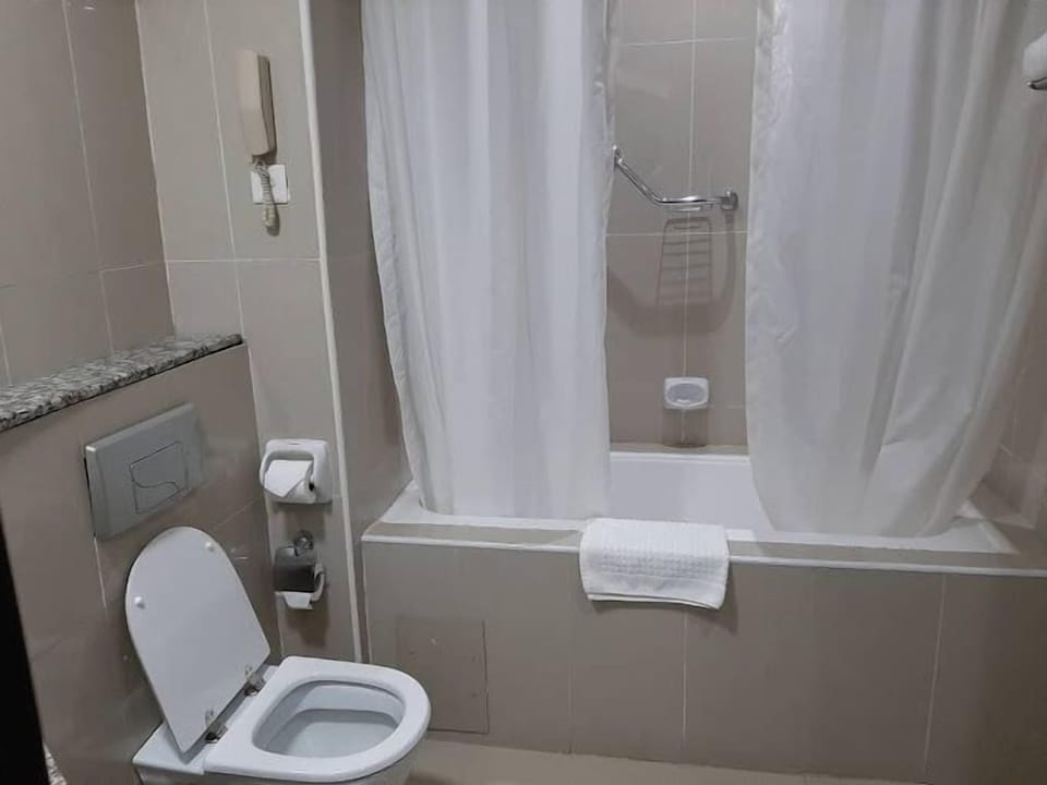 Deluxe Room, Balcony, City View | Bathroom | Free toiletries, hair dryer, towels, soap