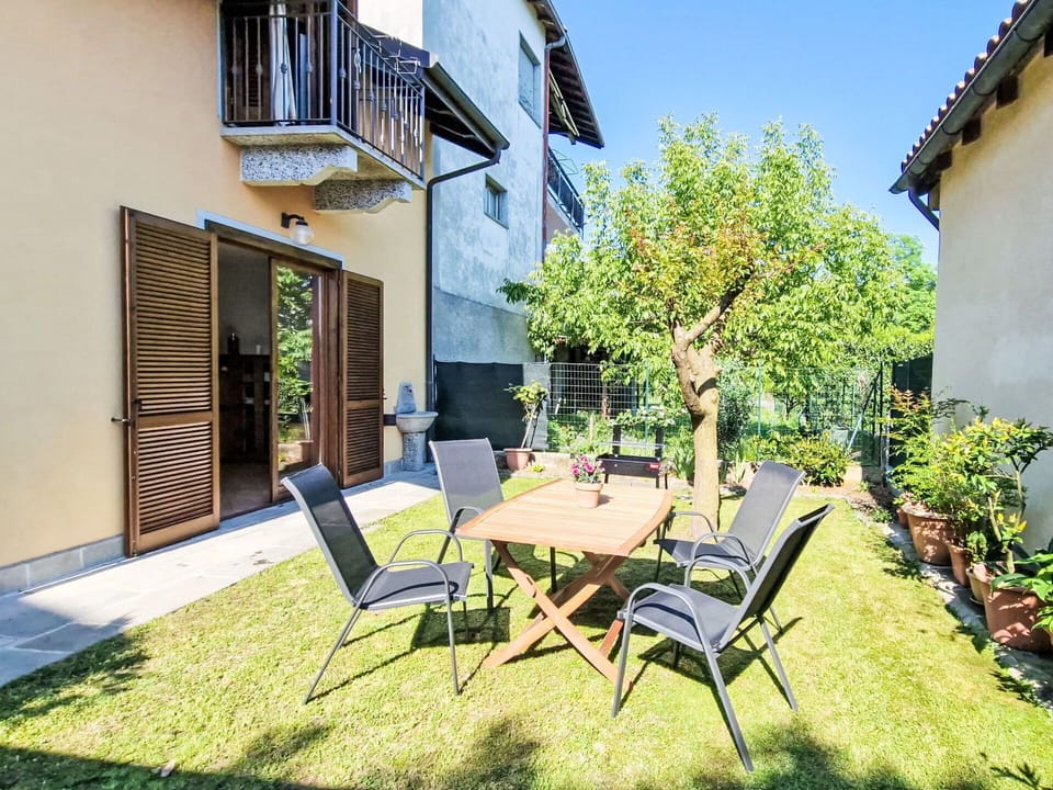 Plant, Furniture, Property, Table, Building, Sky, Azure, Chair, Shade, Wood