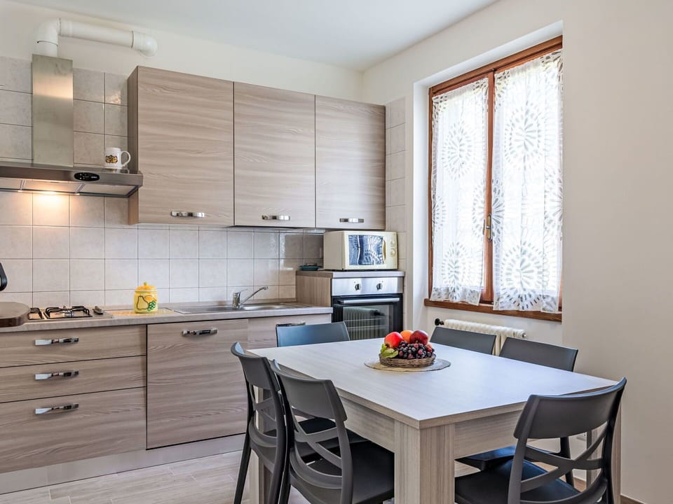 Cabinetry, Furniture, Property, Table, Countertop, Window, Wood, Kitchen Stove, Interior Design, Flooring