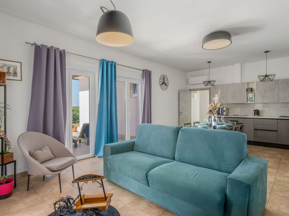 Property, Couch, Blue, Azure, Interior Design, Lighting, Floor, Wall, Curtain, Living Room