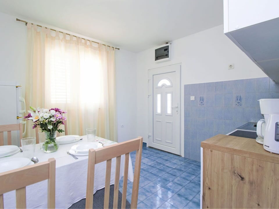 Furniture, Flower, Cabinetry, Wood, Table, Plant, Building, Floor