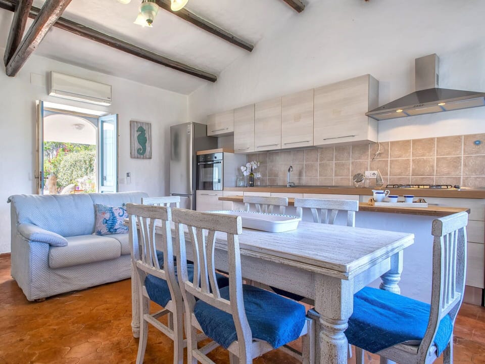Table, Furniture, Property, Countertop, Cabinetry, Azure, Wood, Couch, Chair, Architecture