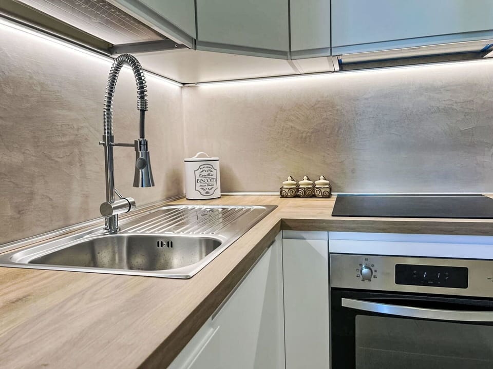 Kitchen, Countertop, Kitchen Appliance, Plumbing Fixture, Wood, Interior Design, Flooring, Home Appliance, Major Appliance, Tap
