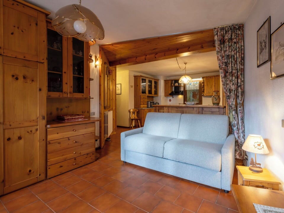 Furniture, Interior Design, Flooring, Wood, Floor, Room, Ceiling, Couch, Table, Lighting