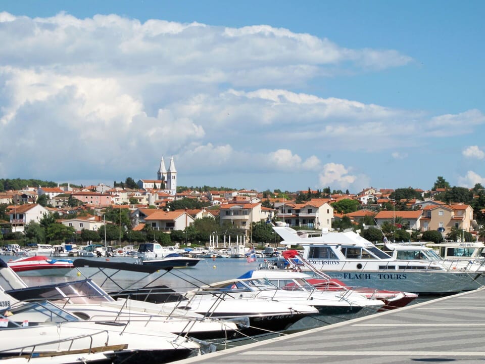 Sky, Cloud, Boat, Watercraft, Building, Water, Dock, Naval Architecture, City, Vehicle