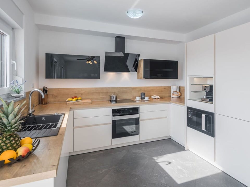 Cabinetry, Countertop, Property, Kitchen, Sink, Kitchen Stove, Home Appliance, Interior Design, Wood